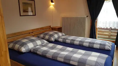Ein Bett oder Betten in einem Zimmer der Unterkunft Ferienwohnung Apres Ski