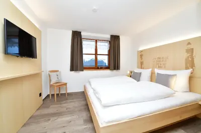 Ein Bett oder Betten in einem Zimmer der Unterkunft Ferienhof Sonne