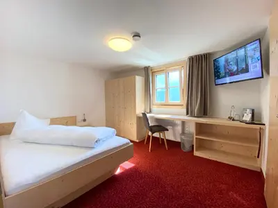 Ein Bett oder Betten in einem Zimmer der Unterkunft 3 Sterne Hotel & Restaurant Panoramagasthof Kristberg