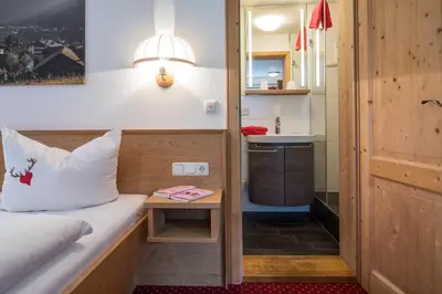 Ein Bett oder Betten in einem Zimmer der Unterkunft Gästehaus Walserheimat