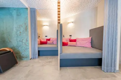 Ein Bett oder Betten in einem Zimmer der Unterkunft Hotel Alpenblume