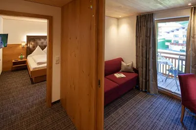 Ein Bett oder Betten in einem Zimmer der Unterkunft Hotel Alpenblume