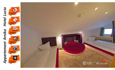 Ein Bett oder Betten in einem Zimmer der Unterkunft Hotel Lucia - 3 Sterne Superior