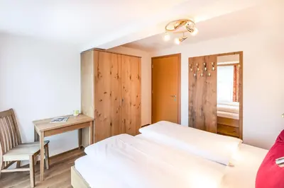 Ein Bett oder Betten in einem Zimmer der Unterkunft Haus Rothorn