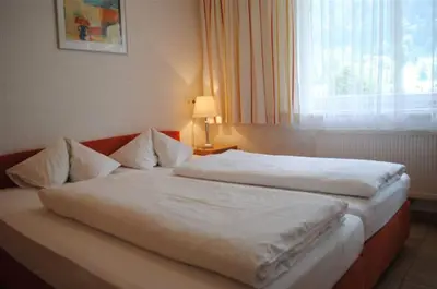 Ein Bett oder Betten in einem Zimmer der Unterkunft Appart Saroja-Tannleger