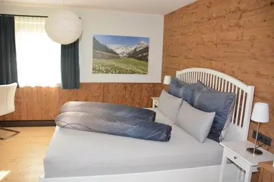 Ein Bett oder Betten in einem Zimmer der Unterkunft Panorama Chalet Montafon