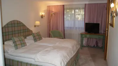 Ein Bett oder Betten in einem Zimmer der Unterkunft Pension Hartenfels