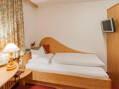 Ein Bett oder Betten in einem Zimmer der Unterkunft Pension Kilian