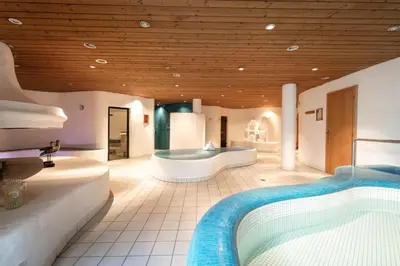 Ein Bett oder Betten in einem Zimmer der Unterkunft Alpenlodge - Das Dorfhotel