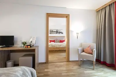 Ein Bett oder Betten in einem Zimmer der Unterkunft Alpenlodge - Das Dorfhotel