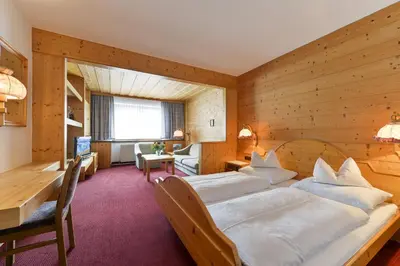 Ein Bett oder Betten in einem Zimmer der Unterkunft Hotel Bergheim