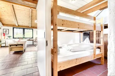Ein Bett oder Betten in einem Zimmer der Unterkunft Chalet Zentral Bach by A-Appartments