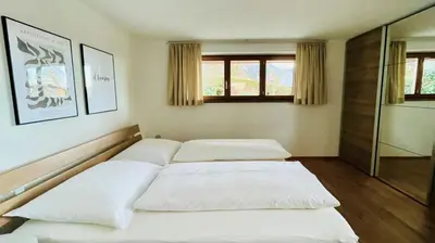 Ein Bett oder Betten in einem Zimmer der Unterkunft Ferienwohnung Geismayr