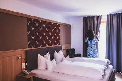 Ein Bett oder Betten in einem Zimmer der Unterkunft Hotel Gasthof KREUZ