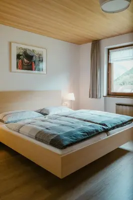 Ein Bett oder Betten in einem Zimmer der Unterkunft Haus Margreth