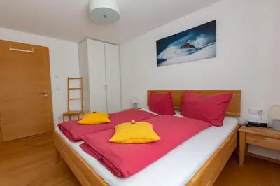 Ein Bett oder Betten in einem Zimmer der Unterkunft Ferienwohnung Wallner