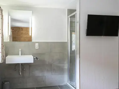 Ein Badezimmer in der Unterkunft Bergwelt-M