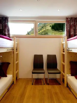 Ein Bett oder Betten in einem Zimmer der Unterkunft Wäldermetzge Hüttenzimmer und Wohnungen