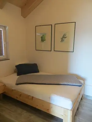 Ein Bett oder Betten in einem Zimmer der Unterkunft Ferienwohnung bei Maly