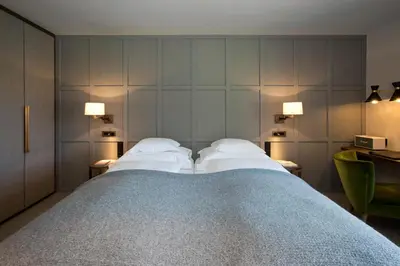 Ein Bett oder Betten in einem Zimmer der Unterkunft Hotel Berghof