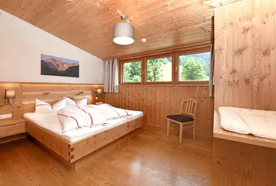 Ein Bett oder Betten in einem Zimmer der Unterkunft Kinderbauernhof