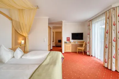 Ein Bett oder Betten in einem Zimmer der Unterkunft Alpinresort Schillerkopf