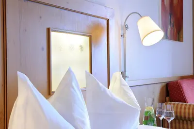 Ein Bett oder Betten in einem Zimmer der Unterkunft Cresta.Alpin.Sport.Hotel