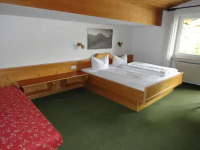 Ein Bett oder Betten in einem Zimmer der Unterkunft Landhaus Almrausch