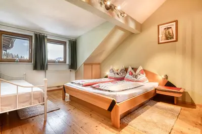 Ein Bett oder Betten in einem Zimmer der Unterkunft Chalet Fischer by A-Appartments