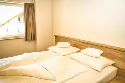Ein Bett oder Betten in einem Zimmer der Unterkunft apart-wolf-arlberg
