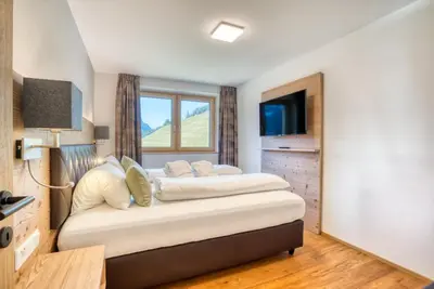 Ein Bett oder Betten in einem Zimmer der Unterkunft HUS23 with Wellness