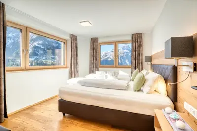 Ein Bett oder Betten in einem Zimmer der Unterkunft HUS23 with Wellness