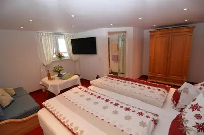 Ein Bett oder Betten in einem Zimmer der Unterkunft Gästehaus am Berg