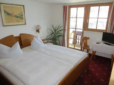 Ein Bett oder Betten in einem Zimmer der Unterkunft Gästehaus am Berg