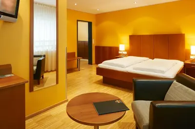 Ein Bett oder Betten in einem Zimmer der Unterkunft Montfort - das Hotel