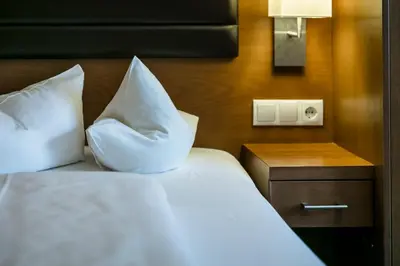 Ein Bett oder Betten in einem Zimmer der Unterkunft Montfort - das Hotel