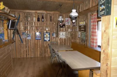 Ein Restaurant oder anderes Speiselokal in der Unterkunft Berg & Skihütte -Schmittenhof