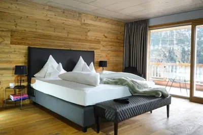 Ein Bett oder Betten in einem Zimmer der Unterkunft Skilodge Oberlech