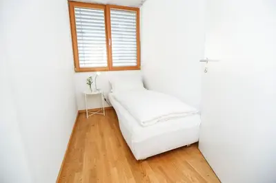 Ein Bett oder Betten in einem Zimmer der Unterkunft Gartenwohnung in prämierter Wohnanlage