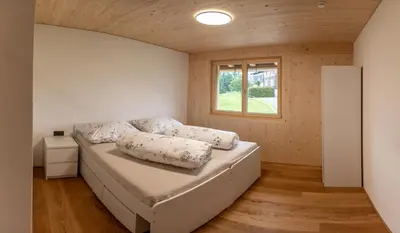 Ein Bett oder Betten in einem Zimmer der Unterkunft Hus Bündt