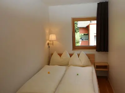 Ein Bett oder Betten in einem Zimmer der Unterkunft Bodensee-Ferienwohnung Am Ruggbach - Lochau bei Bregenz