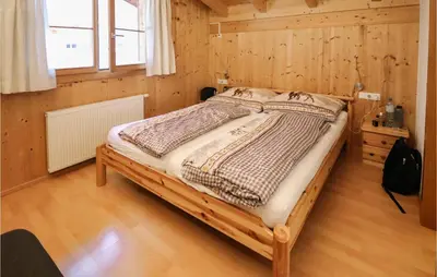 Ein Bett oder Betten in einem Zimmer der Unterkunft Tolles Feriehaus Montafon