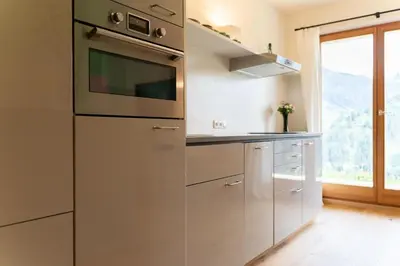 Küche/Küchenzeile in der Unterkunft Alpinikum Apartments