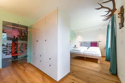 Ein Bett oder Betten in einem Zimmer der Unterkunft Alpinikum Apartments