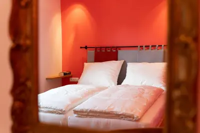 Ein Bett oder Betten in einem Zimmer der Unterkunft Alpinikum Apartments