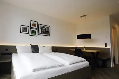 Ein Bett oder Betten in einem Zimmer der Unterkunft Saminapark Aparthotel