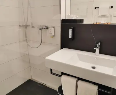 Ein Badezimmer in der Unterkunft Saminapark Aparthotel