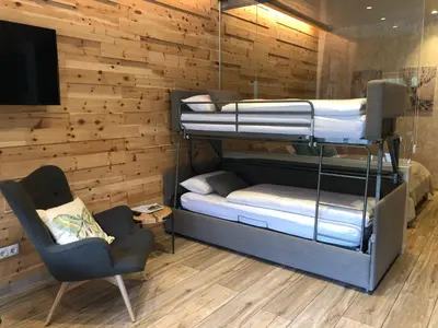 Ein Bett oder Betten in einem Zimmer der Unterkunft Alpenburg Bergparadies Apartments