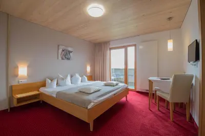 Ein Bett oder Betten in einem Zimmer der Unterkunft Frühstückspension Bilgeri
