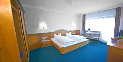 Ein Bett oder Betten in einem Zimmer der Unterkunft Hotel Brunella